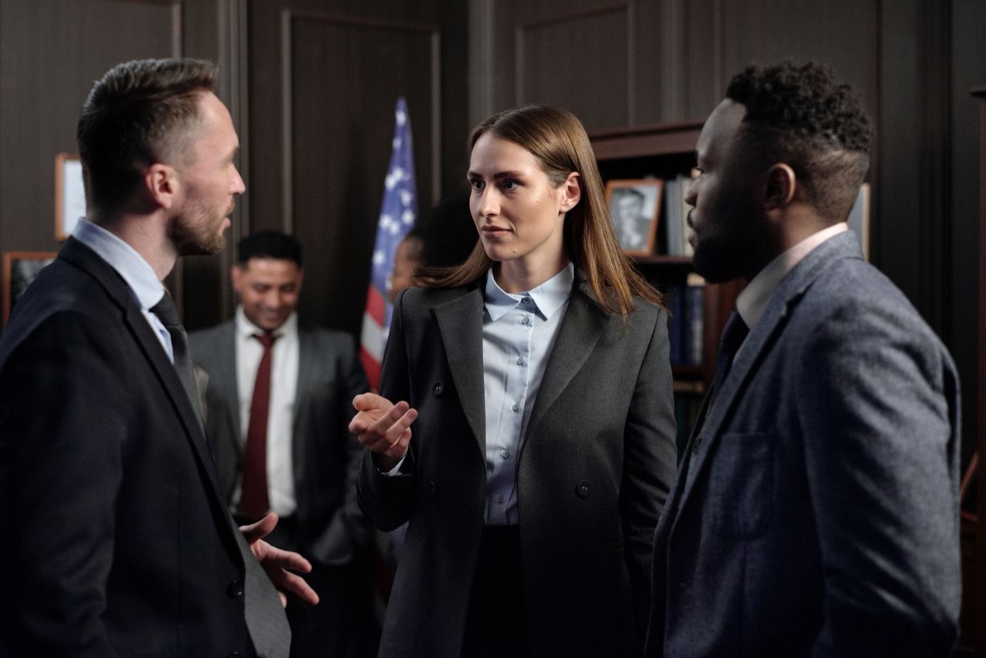 Three attorneys conferring in a law office