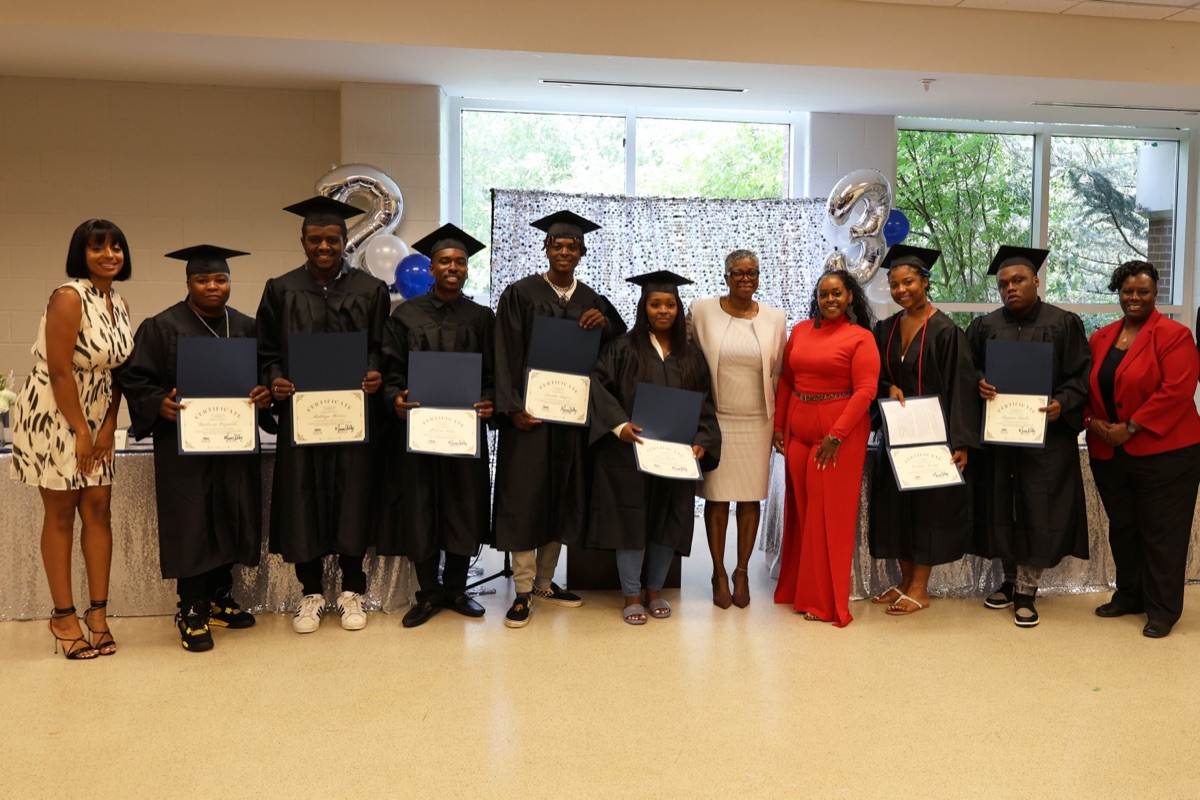 Ladders Program graduating class in caps and gowns
