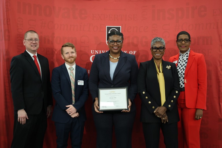 Daveniya Fisher with her Leadership Academy certificate at graduation