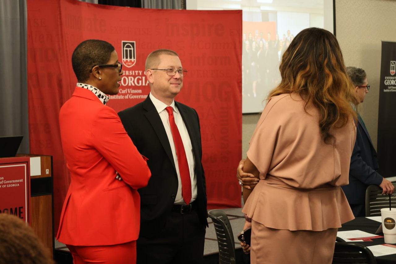 Graduates, leadership, and partners connect during the post-ceremony reception.