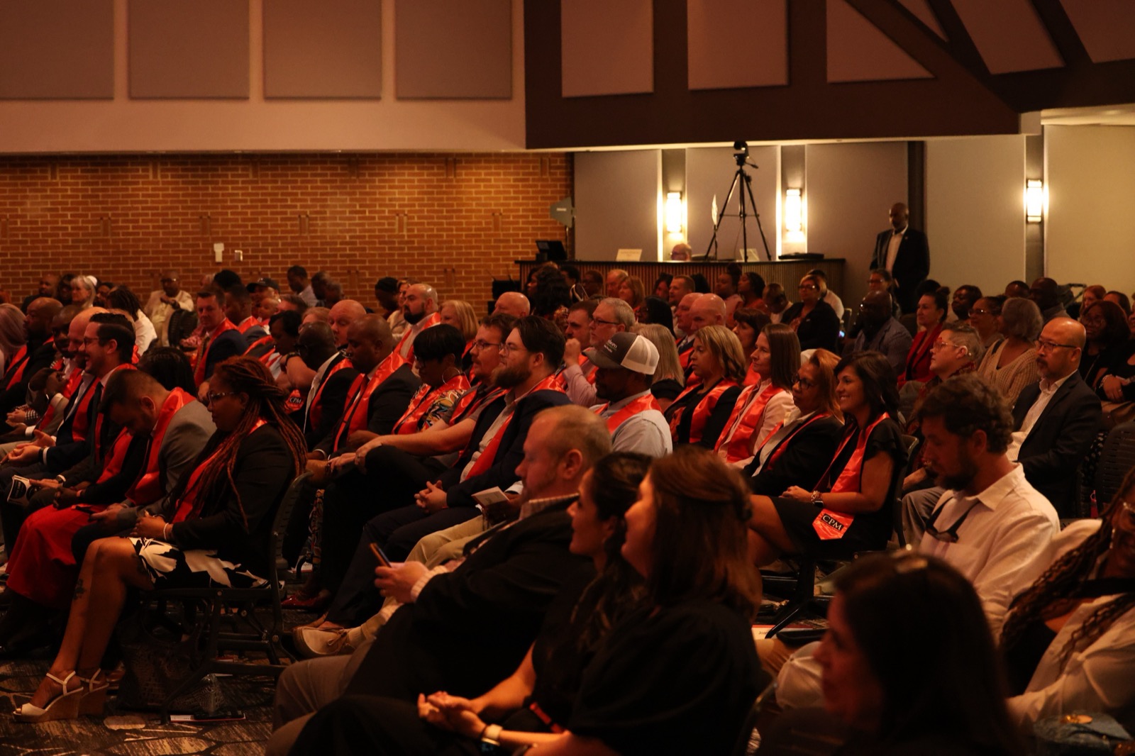 Graduates of the UGA Carl Vinson CPM Program surrounded by family and friends