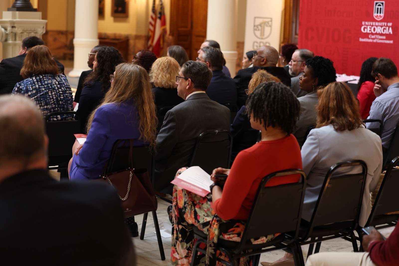 Graduates and attendees take in the ceremony together.
