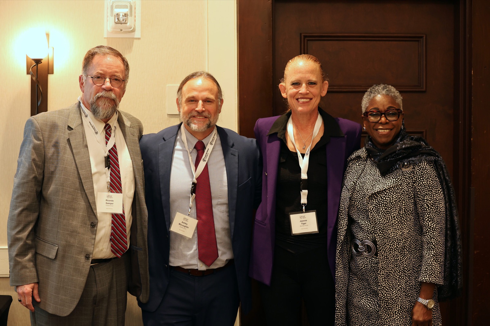 New Circuit public defenders Ricardo Samper, Ashley McLaughlin, Jeanne Tiger with GPDC Director Omotayo Alli