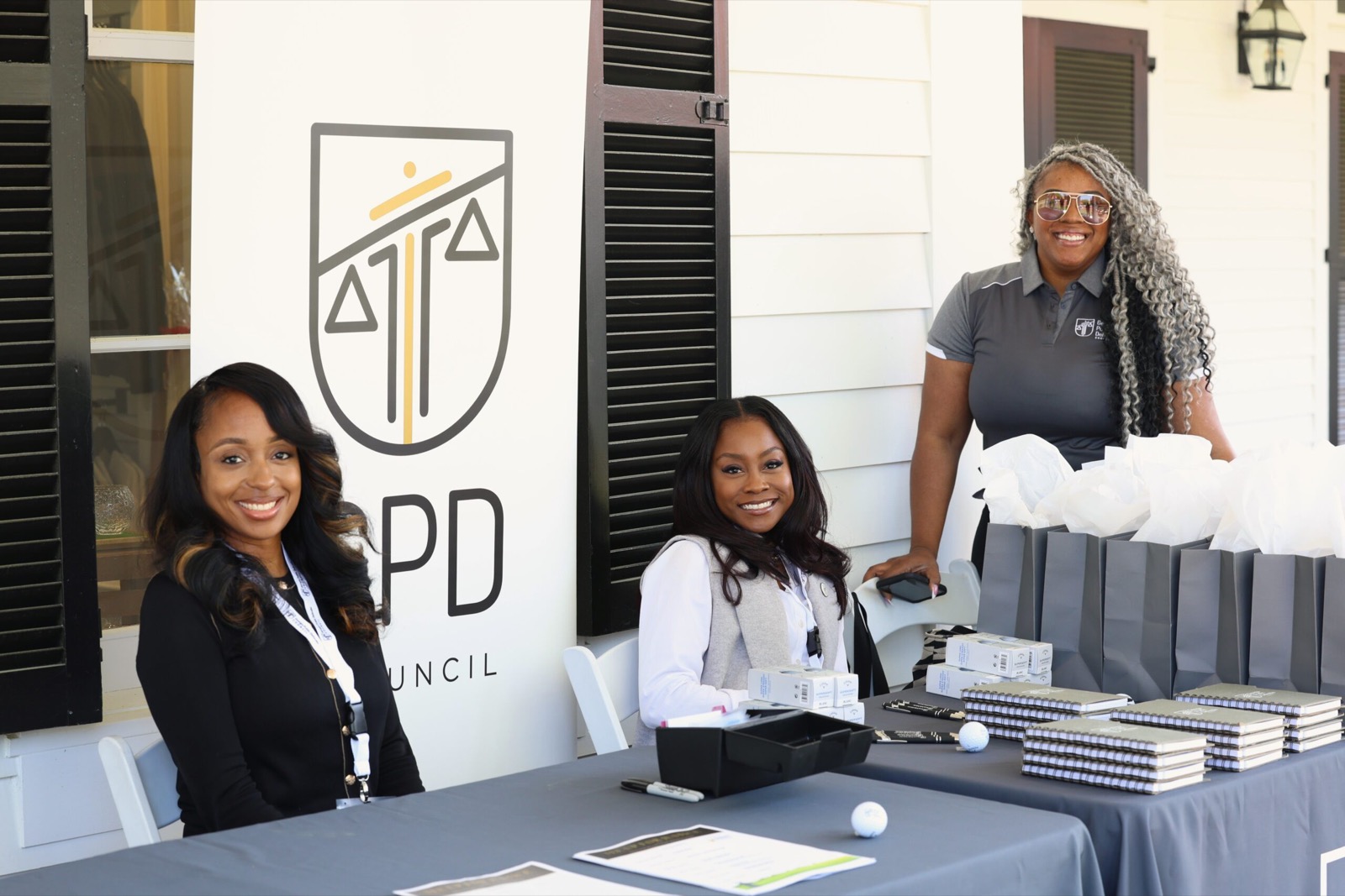 Social Service Managers Catia De Los Santos and Kenya Holmes pictured with Representative Yasmin Neal, who leads GPDC’s Investigator Unit.