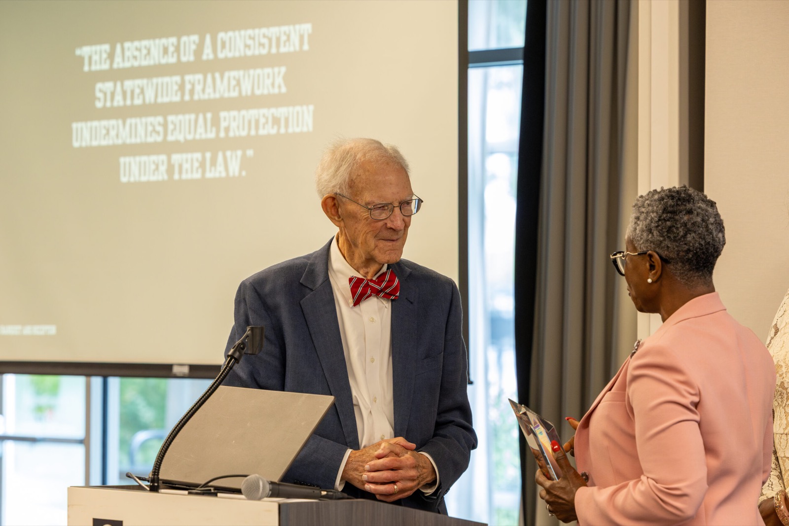 Former Chief Justice Norman S. Fletcher receives the Legacy Award from Omotayo Alli, Executive Director of the Georgia Public Defender Council, in honor of his steadfast commitment to justice and visionary leadership in establishing the Council.