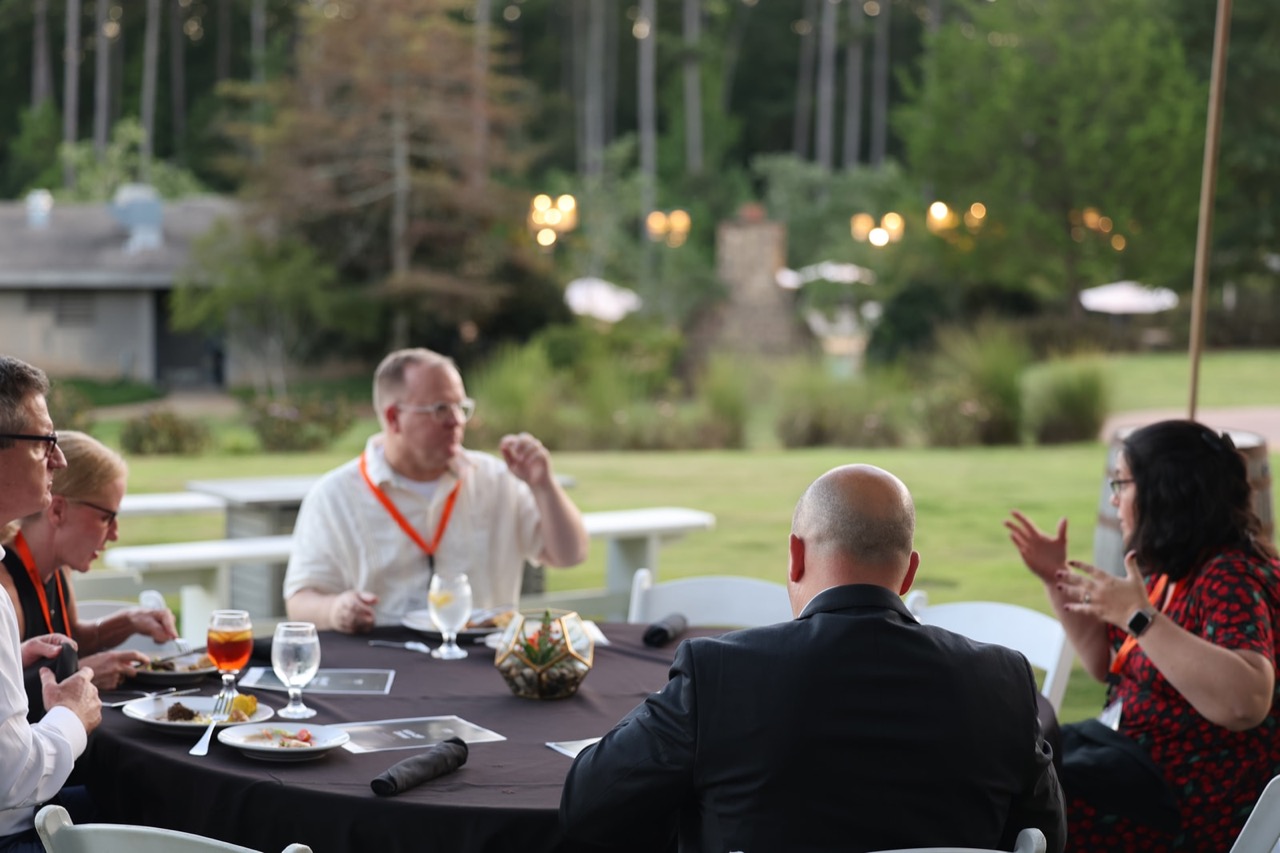 Attendees talk over dinner on the opening evening of the Leadership Academy.